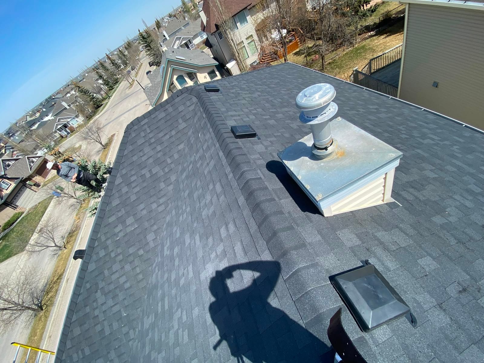 Cricket flashing and a vent stack on a Calgary shingle roof, two of the places leaks most often start