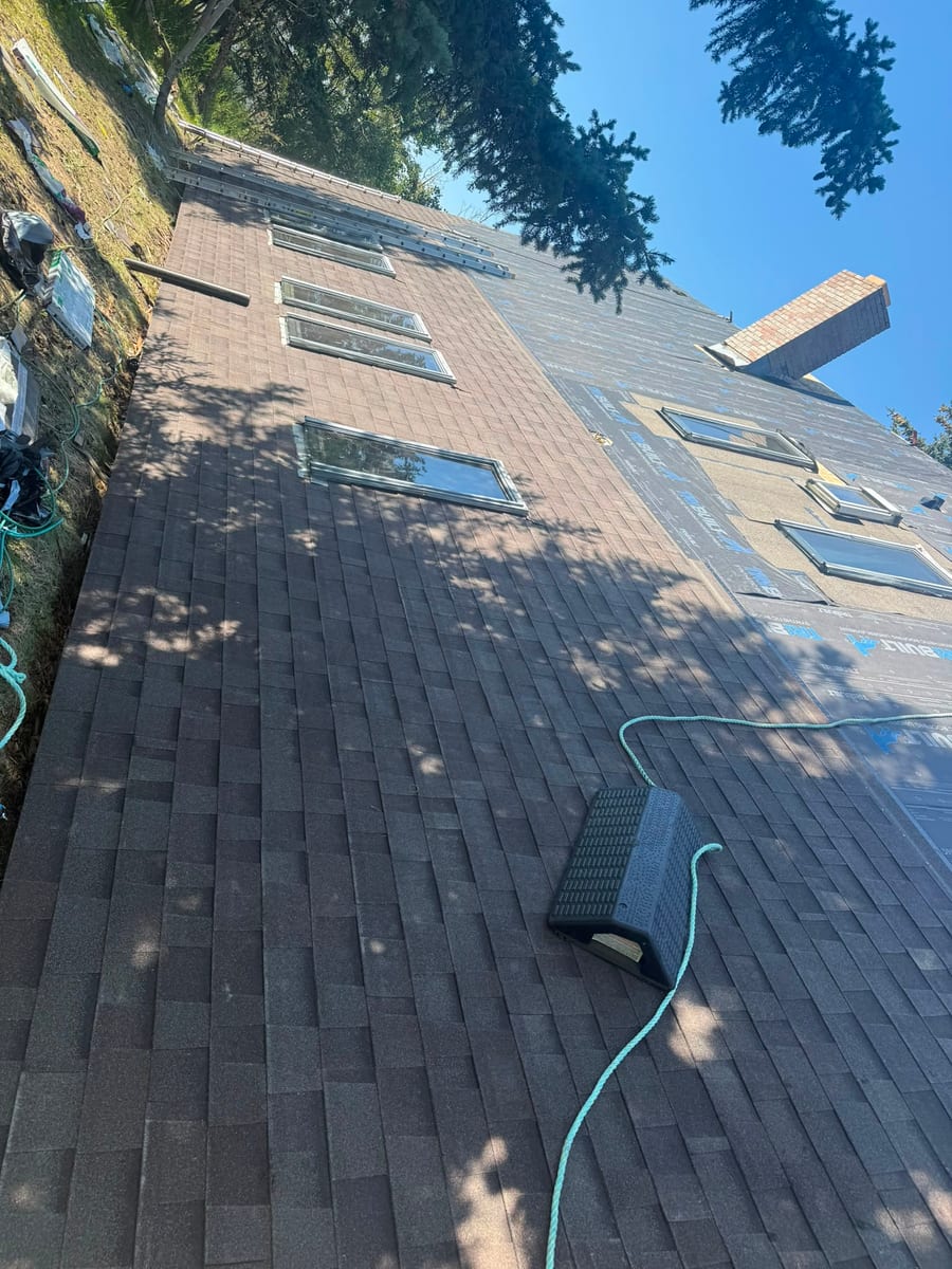Commercial shingle roof replacement in progress on a Calgary building
