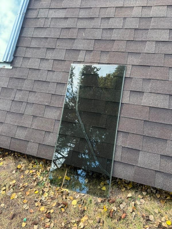 Cracked skylight glass removed for replacement