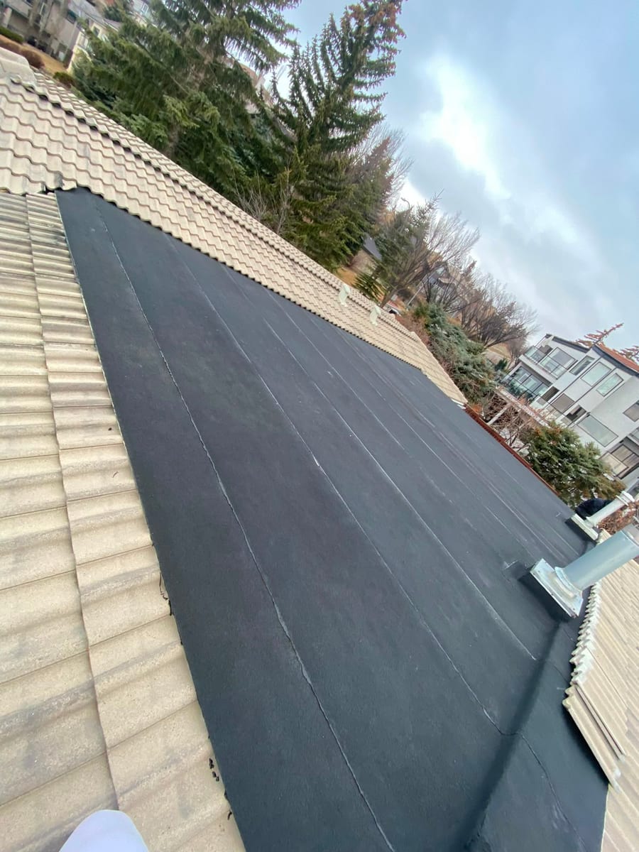 Low-slope membrane roof section on a Calgary house