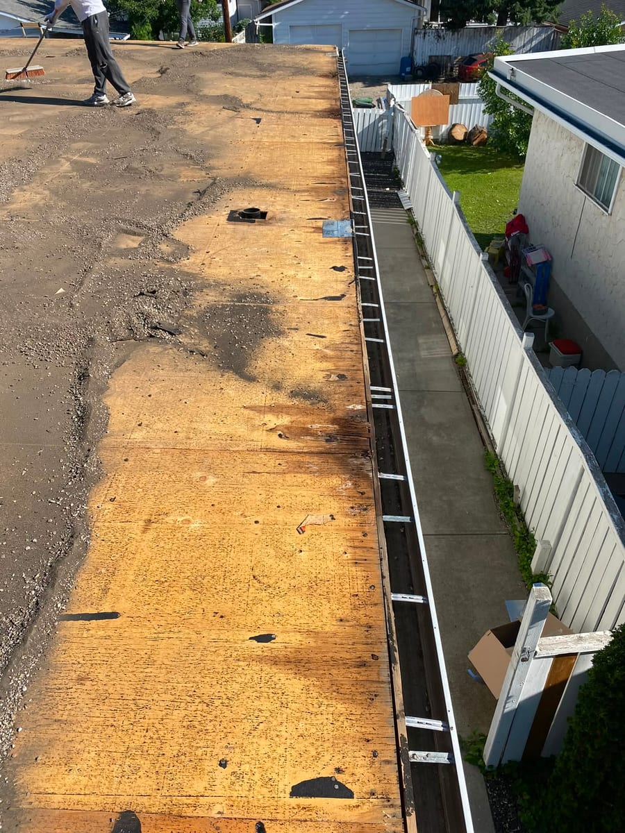 Flat roof torn off down to the plywood deck