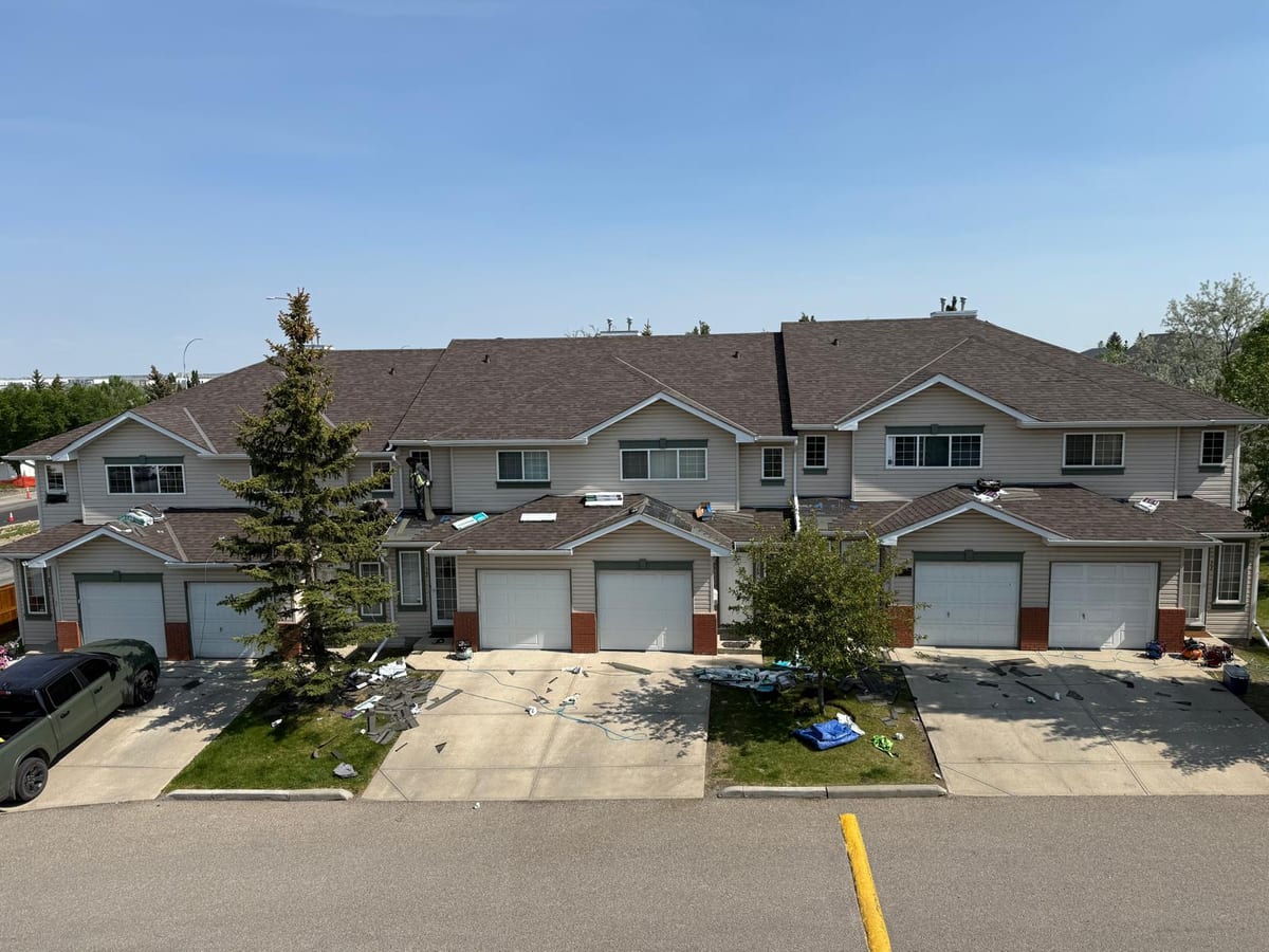 Multi-unit townhouse roof replacement in progress in Calgary