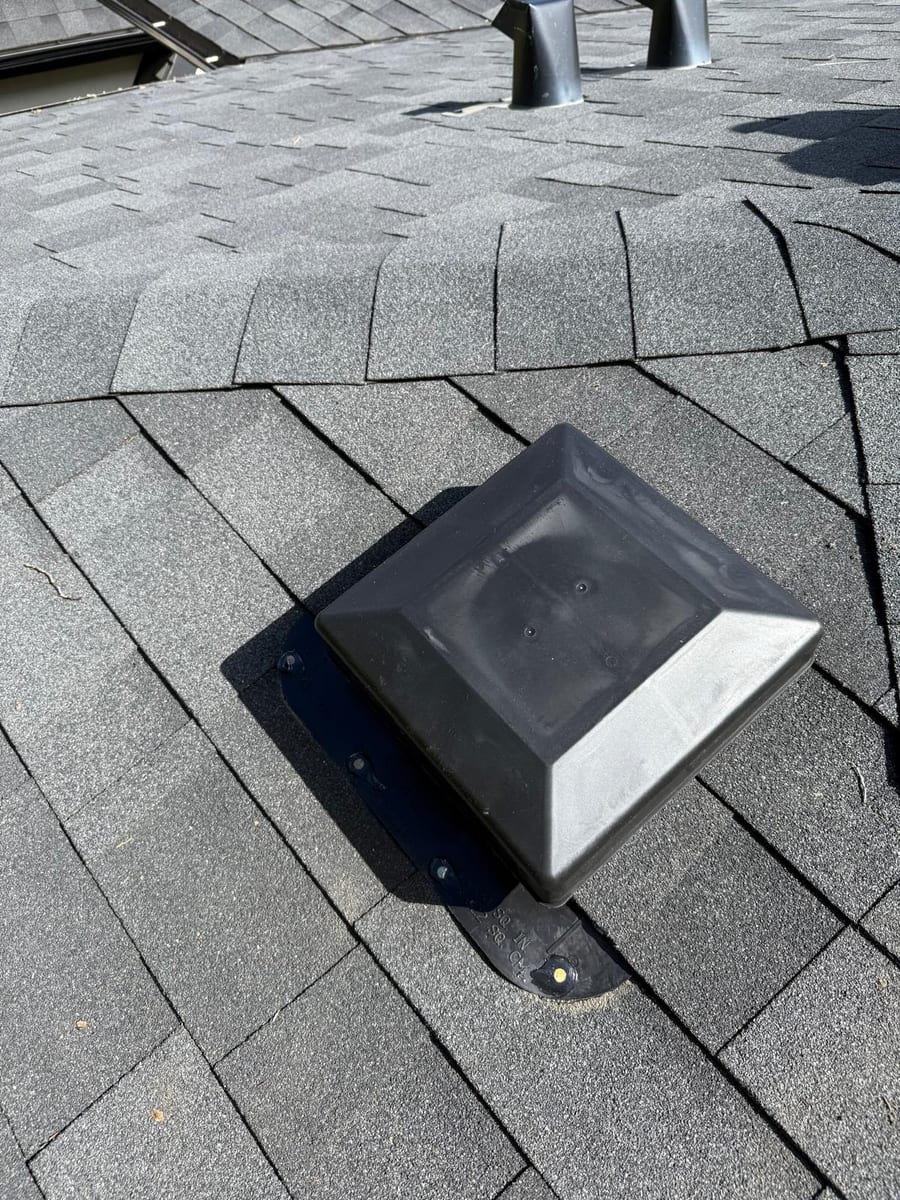 New box vent installed and flashed into a shingle roof