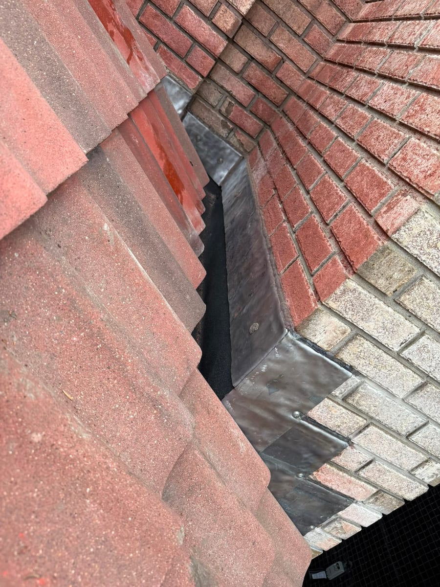 New counter-flashing let into the brick at a chimney