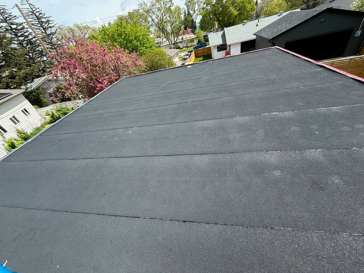 New SBS flat roof over a garage with the cap sheet finished