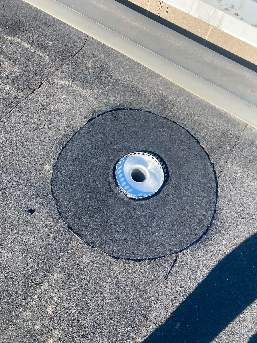 Target patch detail around a drain on an SBS flat roof