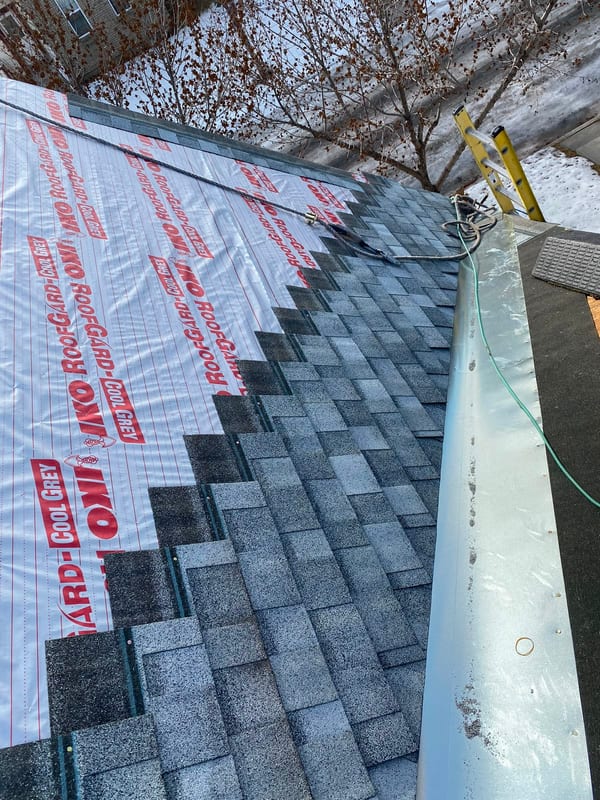 Shingles going down over synthetic underlayment in winter conditions