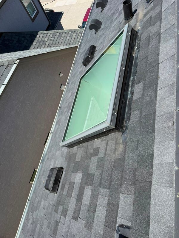 Skylight reflashed on a new shingle roof